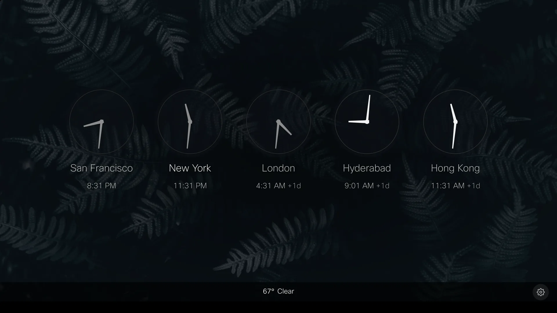 World clocks screensaver: analog dials for several cities over a photographic backdrop, with a slim info strip along the bottom.